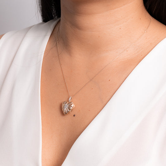 Heart Shaped Locket with Diamond Accents in 10K Yellow and Rose Gold (0.16 ct tw)