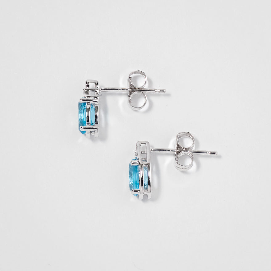 Oval Blue Topaz Earrings in 10K White Gold