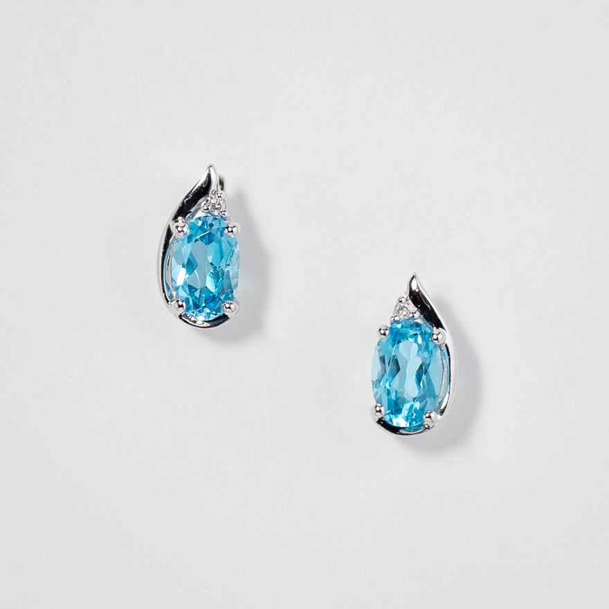 Oval Blue Topaz Earrings in 10K White Gold