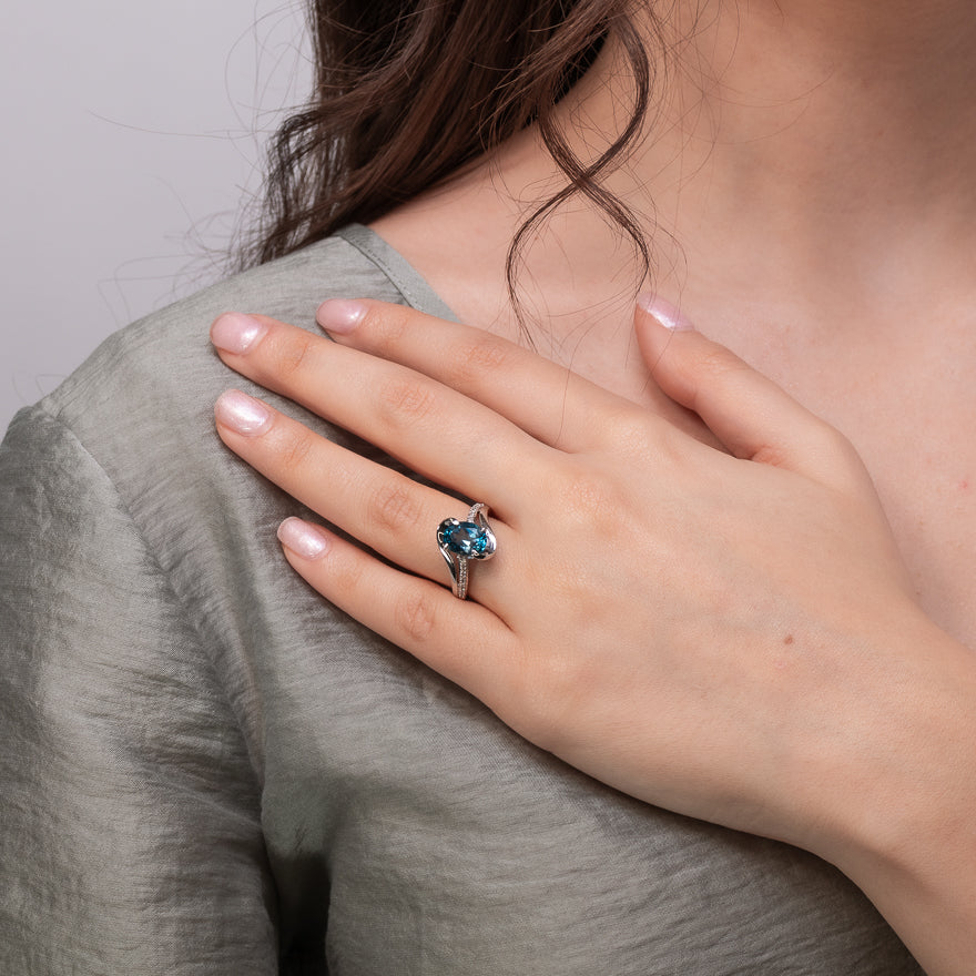 Oval Blue Topaz Ring With Diamond Accents 10K White Gold