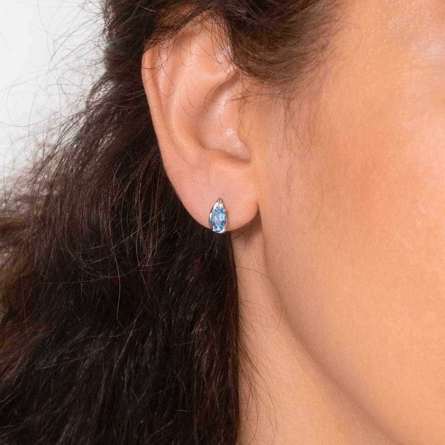 Oval Blue Topaz Earrings in 10K White Gold