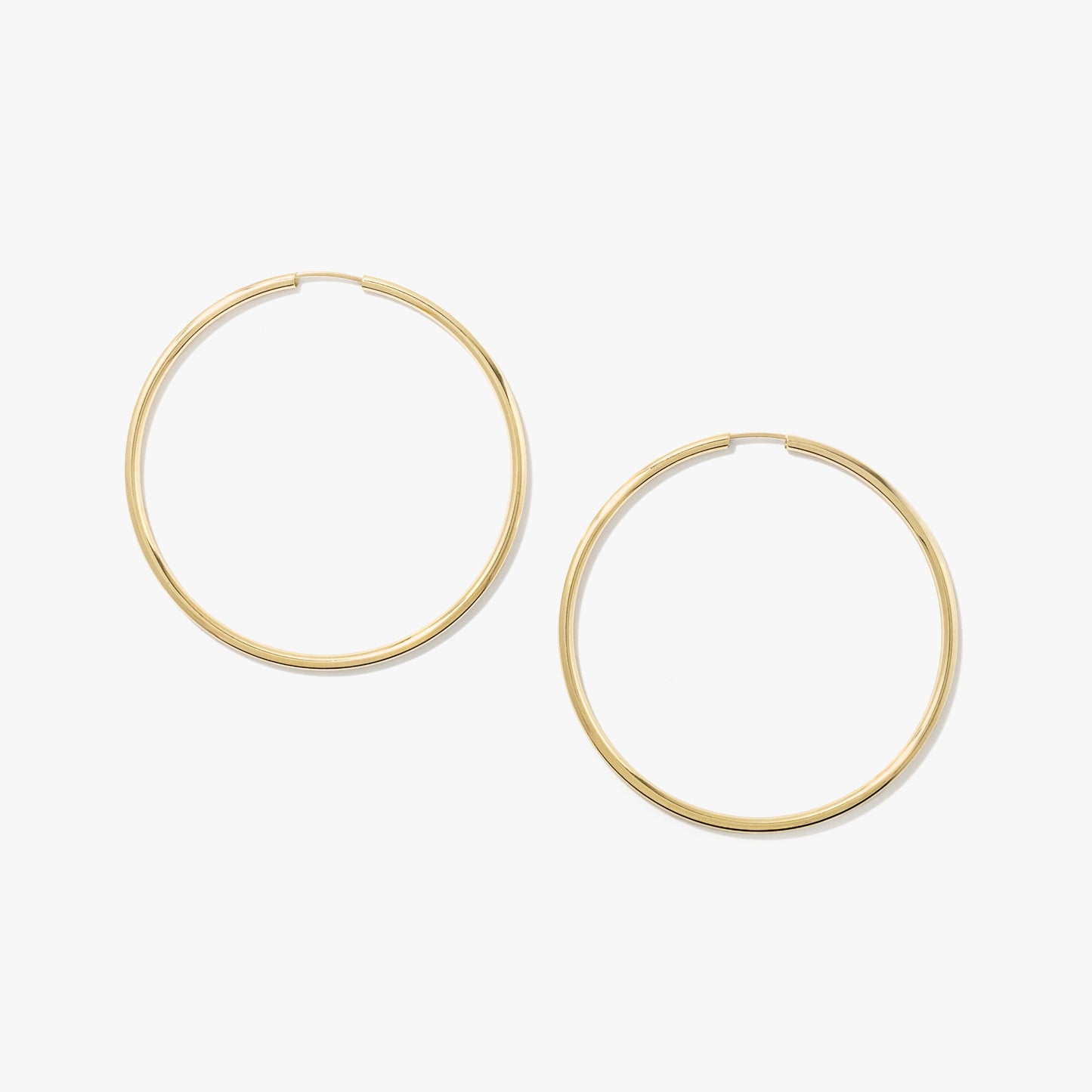 1.6x40mm Sleeper Earrings in 10K Yellow Gold