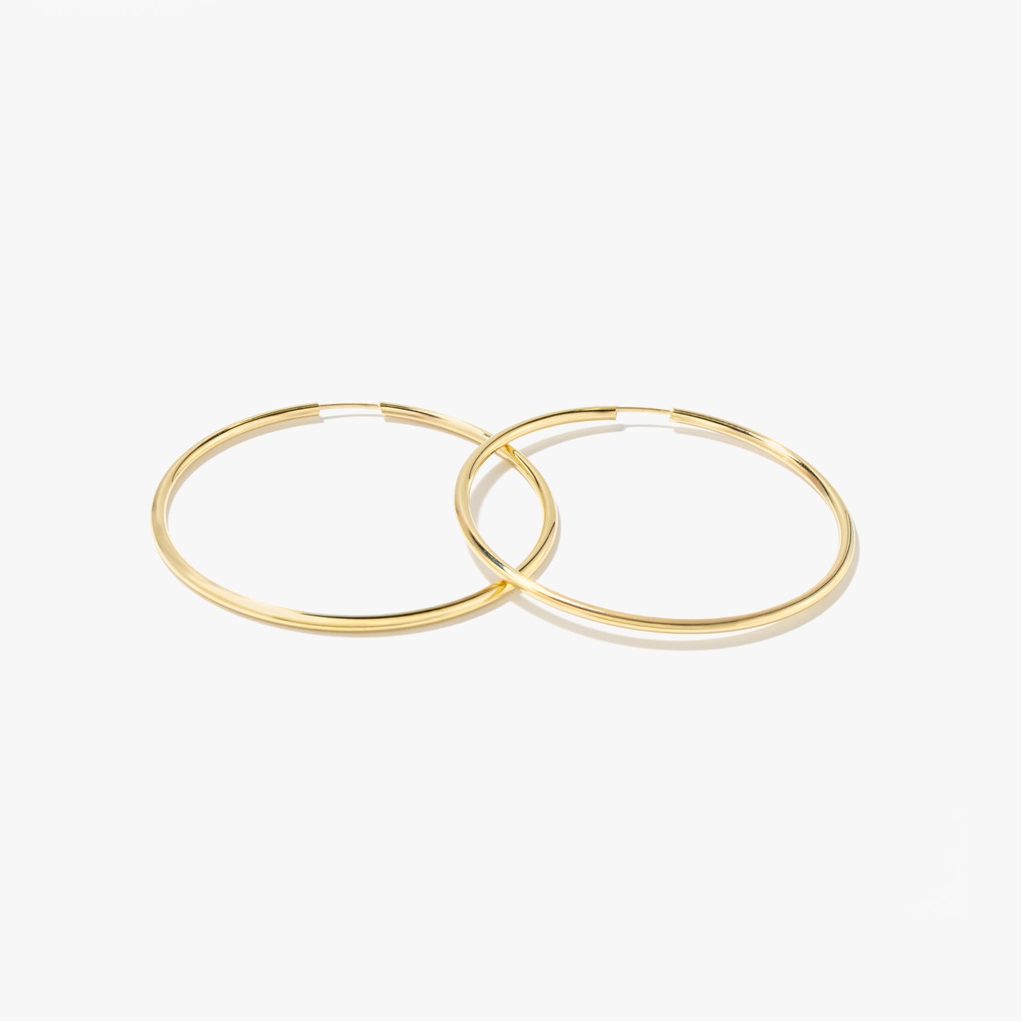 1.6x40mm Sleeper Earrings in 10K Yellow Gold
