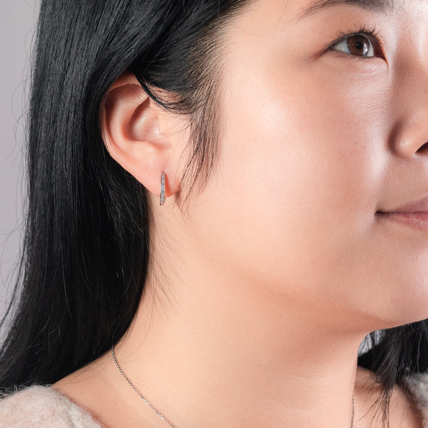 Micro Claw-Set Diamond Huggie Hoop Earrings in 10K White Gold (0.05ct tw)