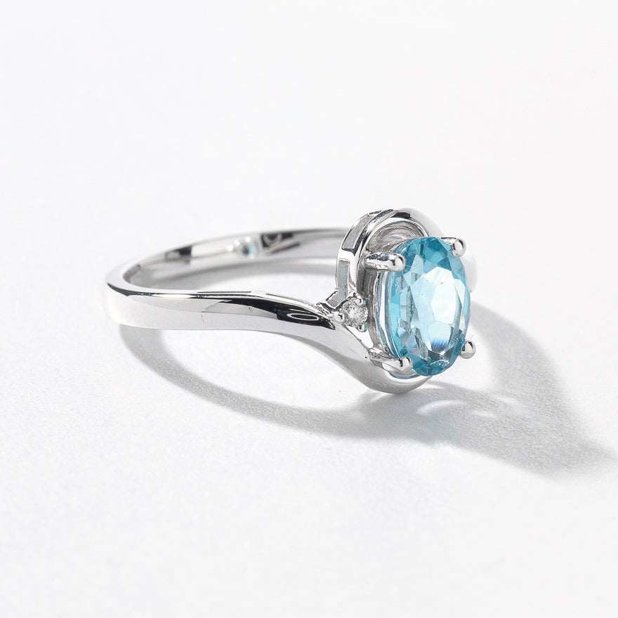 Oval Blue Topaz Ring With Diamond Accents in 10K White Gold