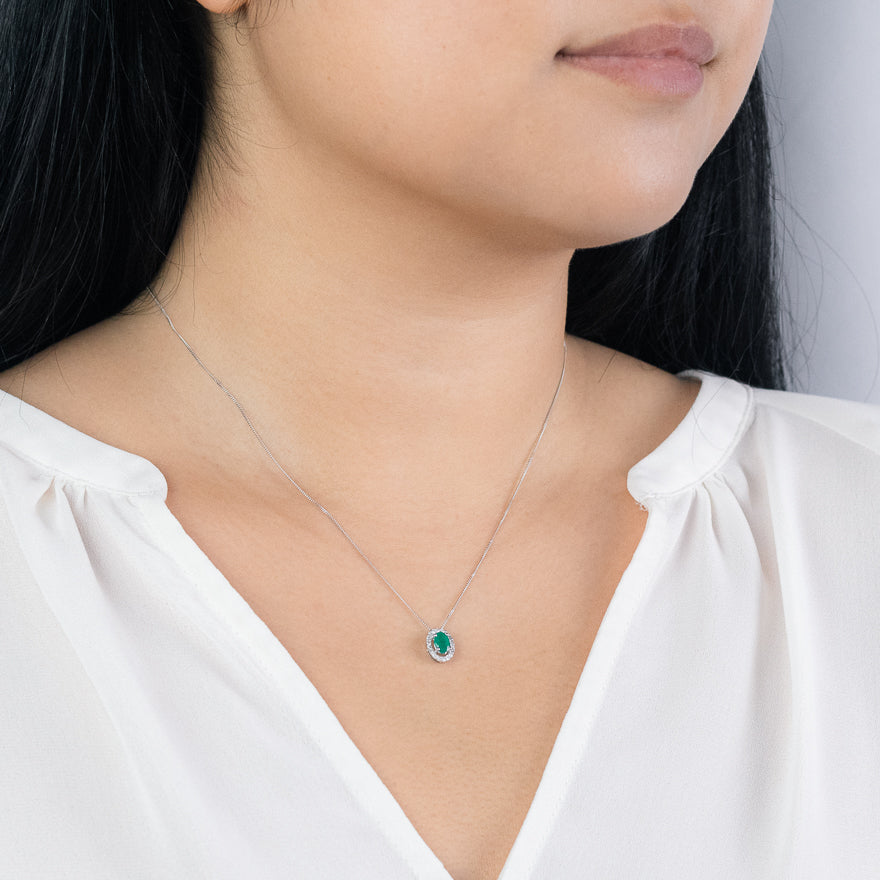 Oval Emerald and Diamond Halo Necklace in 10K White Gold (0.12ct tw)